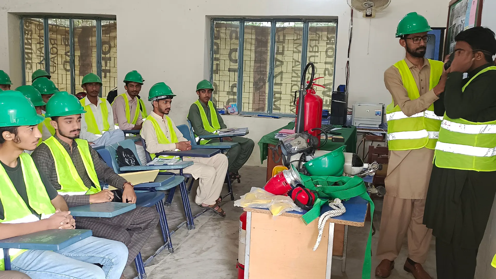 Professional safety instructor leading a certified safety officer training course for HSE students at a training facility in Lahore, Pakistan.